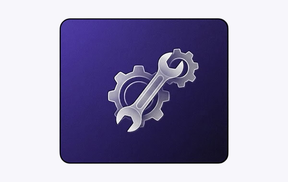Gear and spanner on an indigo tile, representing website maintenance